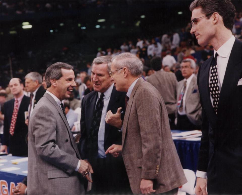 From left to right: Roy Williams, Dean Smith, Bill Guthridge and Matt Doherty. The four coaches chatted with each other just before UNC beat Kansas in the 1993 Final Four basketball tournament in New Orleans. Williams was the head coach at Kansas at the time and Doherty was his assistant. Smith was UNC’s head coach and Guthridge was his assistant. All four men would eventually serve as the head coach at UNC.