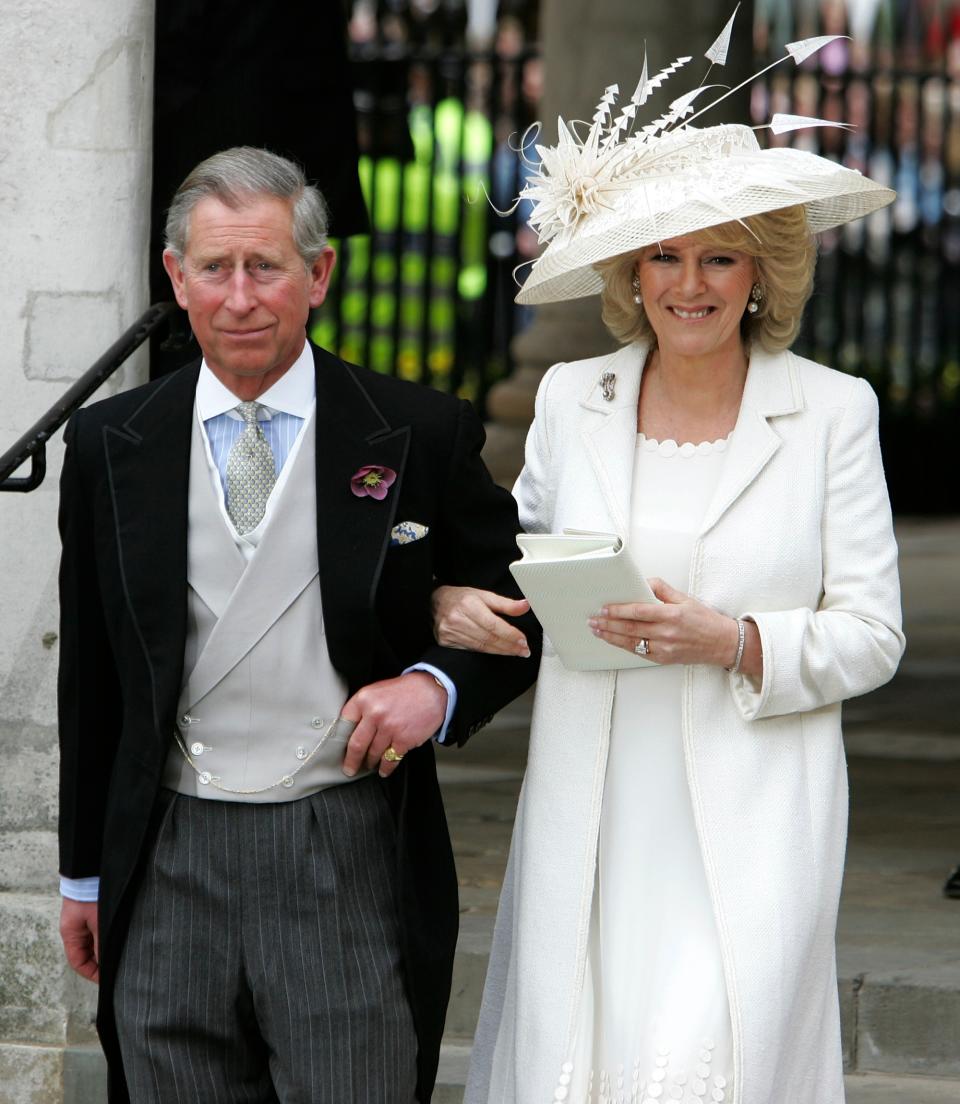 HRH Prince Charles & Mrs Camilla Parker Bowles Marry At Guildhall Civil Cer
LONDON - APRIL 09: TRH Prince Charles, the Prince of Wales, and his wife Camilla, the Duchess of Cornwall, depart the Civil Ceremony at which they were legally married, at The Guildhall, Windsor on April 9, 2005 in Berkshire, England. (Photo by Georges De Keerle/Getty Images)