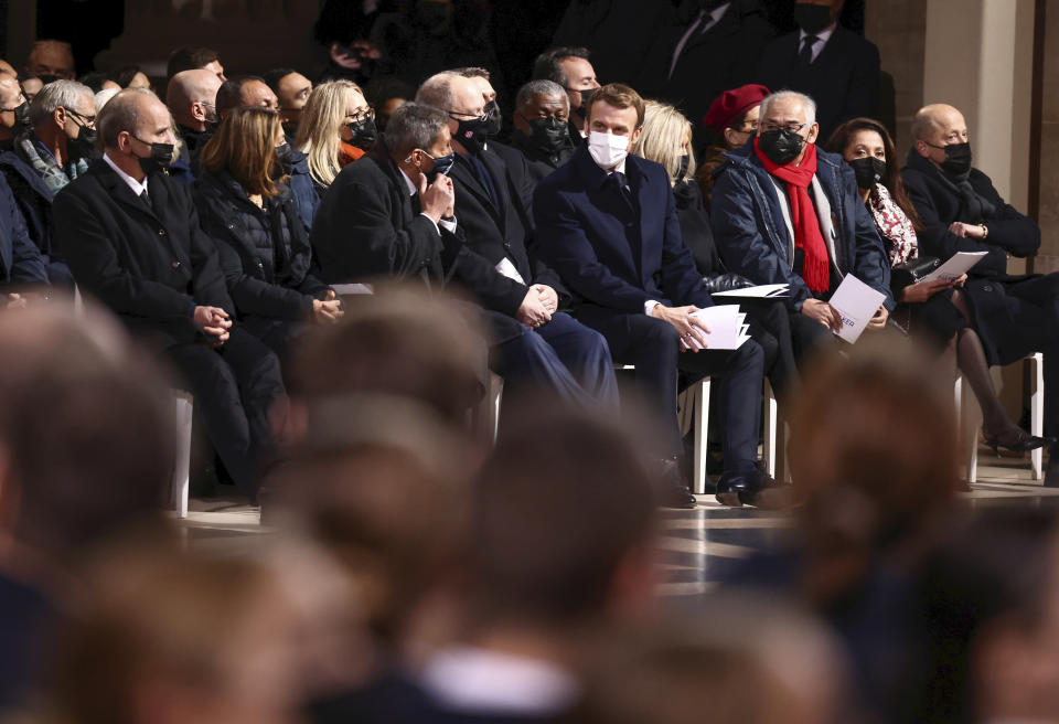 French President Emmanuel Macron, center, officials attend a ceremony honouring France U.S.-born entertainer, anti-Nazi spy and civil rights activist Josephine Bakerin at the Pantheon in Paris, France, Tuesday, Nov. 30, 2021, where she is to symbolically be inducted, becoming the first Black woman to receive France's highest honor. Her body will stay in Monaco at the request of her family. (Sarah Meyssonnier/Pool Photo via AP)