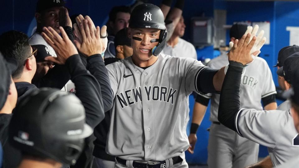 May 15, 2023; Toronto, Ontario, CAN; New York Yankees right fielder Aaron Judge (99) celebrates in the dugout after hitting a home run against the Toronto Blue Jays during the eighth inning at Rogers Centre.