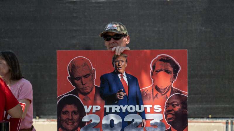 A sign displays Republican presidential candidates at the GOP primary debate in Wisconsin