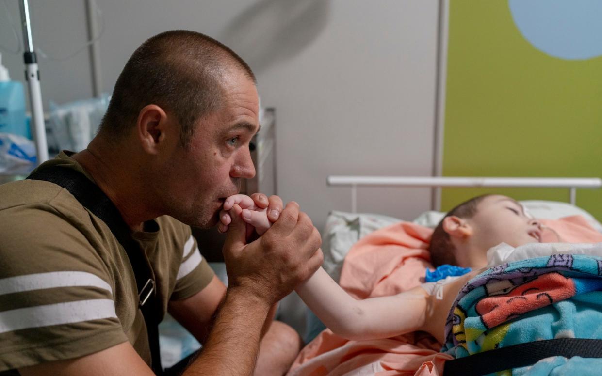 A family waits for an evacuation for their child in the hospital