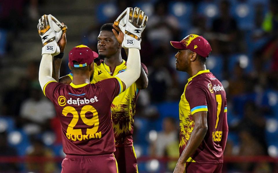 Alzarri Joseph is congratulated after dismissing Jacob Bethell.