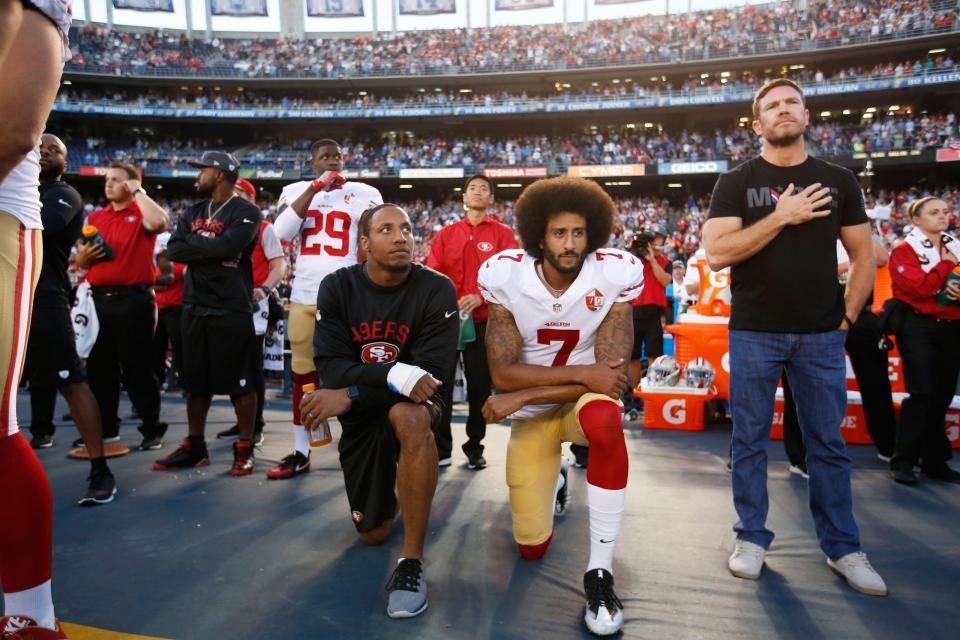 Eric Reid (L) and Colin Kaepernick of the San Francisco 49ers kneel during the national anthem on Sept. 1, 2016 (Getty/Michael Zagaris)