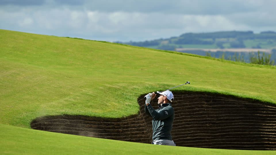 England's Oliver Wilson plays out of a bunker on the 17th hole during a practice round.  - Glyn Kirk/AFP/Getty Images