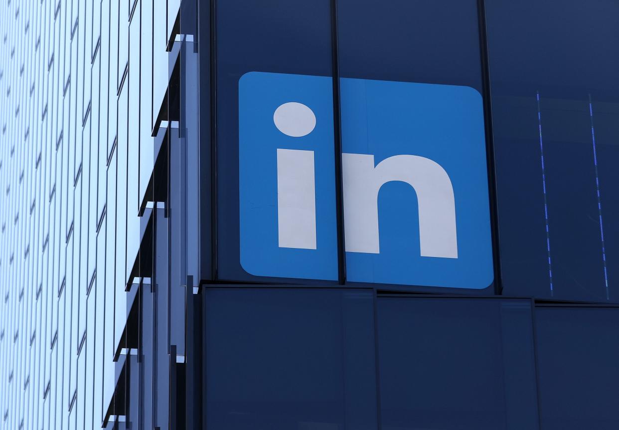 A sign is posted on the exterior of a LinkedIn office on July 26, 2023 in San Francisco. Multiple users have reported encountering an error trying to open the platform.