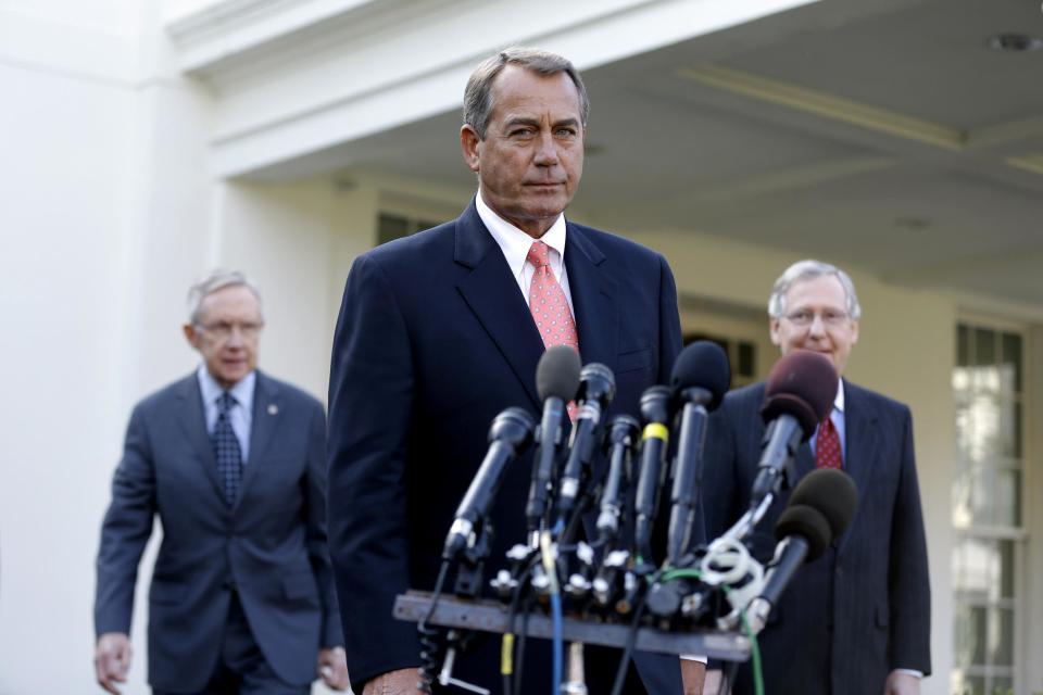 House Speaker John Boehner of Ohio, center, followed by Senate Majority Leader Harry Reid of Nev., left, and Senate Minority Leader Mitch McConnell of Ky., approaches the microphones outside the White House in Washington on Friday, Nov. 16, 2012, to speaks to reporters following their meeting with President Barack Obama to discuss the economy and the deficit. (AP Photo/Jacquelyn Martin)