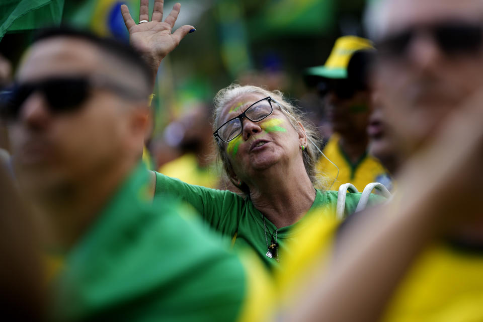 A supporter of President Jair Bolsonaro attends a protest against his defeat to President-elect Luiz Inacio Lula da Silva in the presidential runoff election, in Rio de Janeiro, Brazil, Sunday, Nov 6, 2022. Thousands of supporters called on the military to keep Bolsonaro in power, even as his administration signaled a willingness to hand over the reins to da Silva. (AP Photo/Silvia Izquierdo)