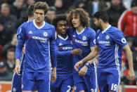 <p>Chelsea’s Willian, centre left, celebrates after scoring with Chelsea’s David Luiz, centre right, during the English Premier League soccer match between Stoke City and Chelsea at the Britannia Stadium, Stoke on Trent, England, Saturday, March 18, 2017. (AP Photo/Rui Vieira) </p>