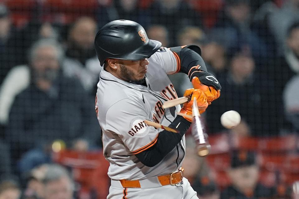 San Francisco Giants' Thairo Estrada breaks his bat and was able to reach on a fielding error by Boston Red Sox shortstop Ceddanne Rafaela during the eighth inning of a baseball game, Tuesday, April 30, 2024, in Boston. (AP Photo/Michael Dwyer)