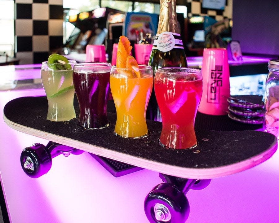 Level 1 Arcade Bar offers retro games and custom cocktails.