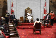 Chief of Defence Staff Jonathan Vance, front left to right, Prime Minister Justin Trudeau, Senator Marc Gold , and RCMP Commissioner Brenda Lucki listen as Gov. Gen. Julie Payette, middle, delivers the throne speech in the Senate chamber in Ottawa on Wednesday, Sept. 23, 2020. (Adrian Wyld/The Canadian Press via AP)