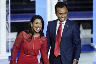 FILE - Republican presidential candidate businessman Vivek Ramaswamy and his wife Apoorva walks on stage after a Republican presidential primary debate hosted by NBC News, Nov. 8, 2023, at the Adrienne Arsht Center for the Performing Arts of Miami-Dade County in Miami. Ramaswamy's presidential campaign has seemingly mirrored his meteoric rise as a biotech entrepreneur. The political novice from Ohio has taken the route of a self-described outsider.(AP Photo/Rebecca Blackwell, File)