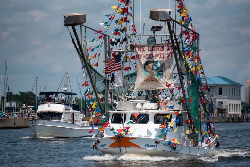 A boat decorated with flags during the Blessing of the Fleet in Biloxi on Sunday, May 28, 2023.