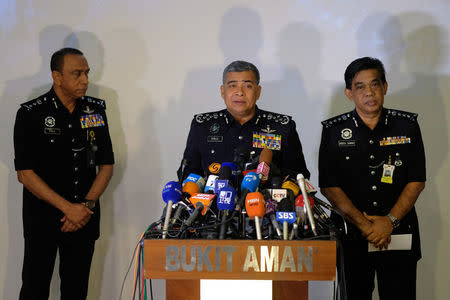 FILE PHOTO: Malaysia's Royal Police Chief Khalid Abu Bakar (C) speaks during a news conference regarding the apparent assassination of Kim Jong Nam, the half-brother of the North Korean leader, at the Malaysian police headquarters in Kuala Lumpur, Malaysia, February 22, 2017. REUTERS/Athit Perawongmetha