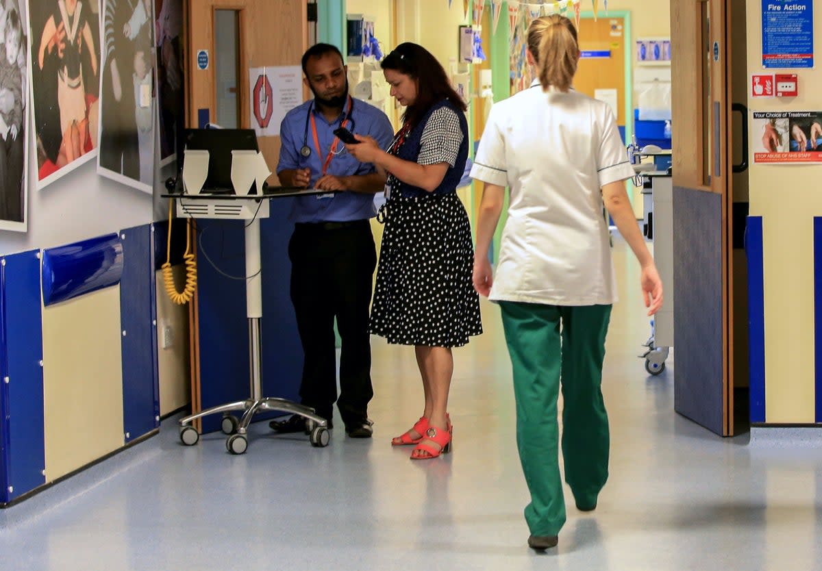 Doctors have added their voices to criticism of a decision to cut enhanced sick pay and special leave for NHS workers in England who are off work with Covid-19 (Peter Byrne/PA) (PA)