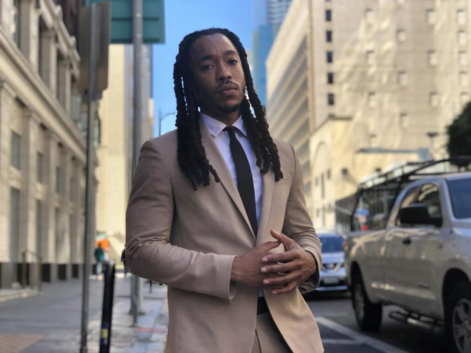 Screenwriter and security guard Chadwick Davis, 33, poses in downtown Los Angeles' South Park neighborhood.