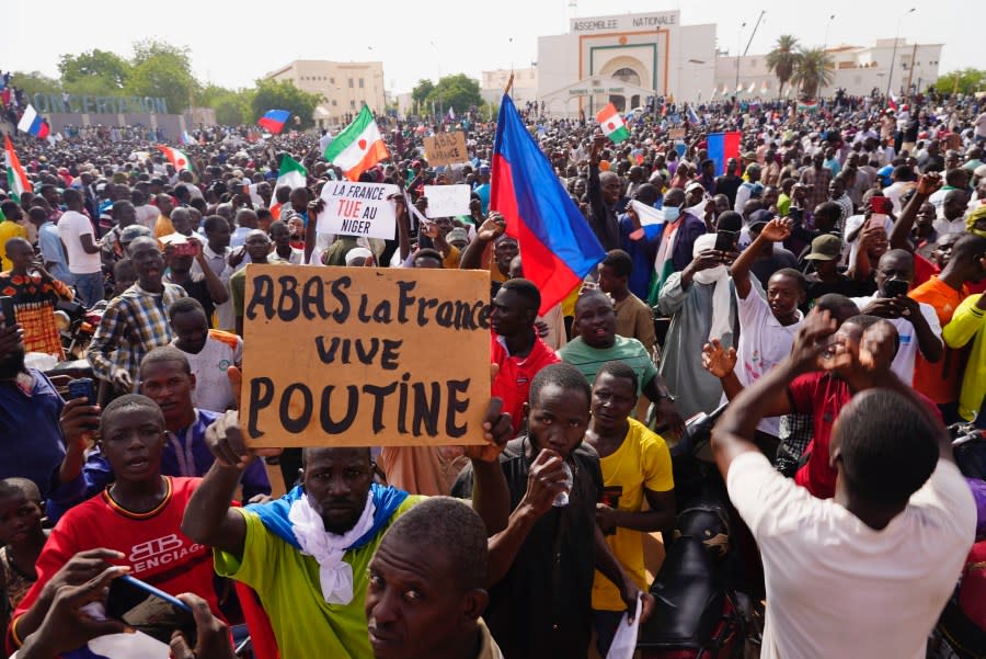 Nigeriens participate in a march called by supporters of coup leader Gen. Abdourahmane Tchiani in Niamey, Niger, Sunday, July 30, 2023. (AP Photo/Sam Mednick, File)