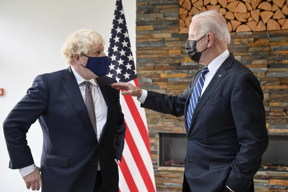 Image: Biden, right, talks with Johnson on Thursday ahead of the summit (Toby Melville / AP)