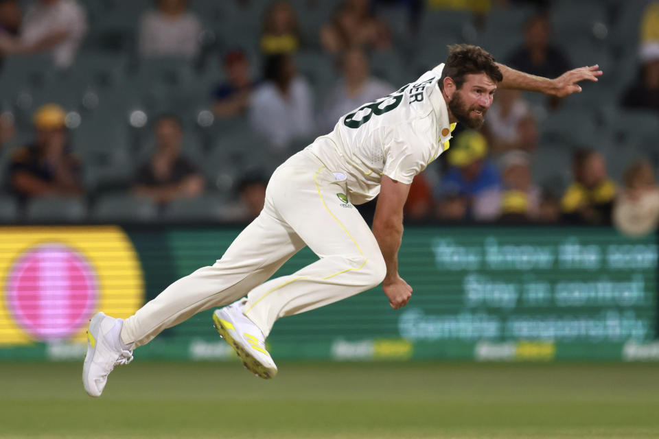 Australia's Michael Neser bowls to the West Indies on the third day of their cricket test match in Adelaide, Saturday, Nov. 10, 2022. (AP Photo/James Elsby)