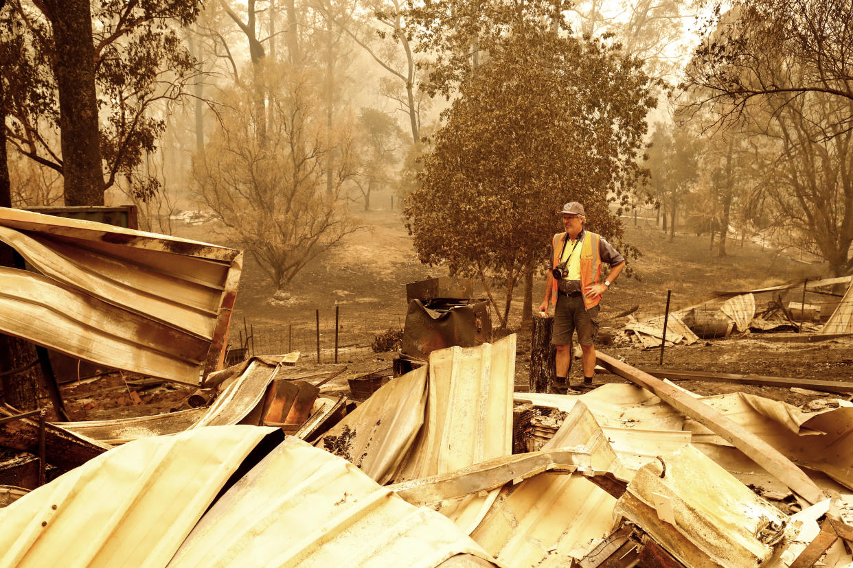 Sarsfield resident Wayne Johnston inspects damage to his property in Sarsfield, Australia.&nbsp;