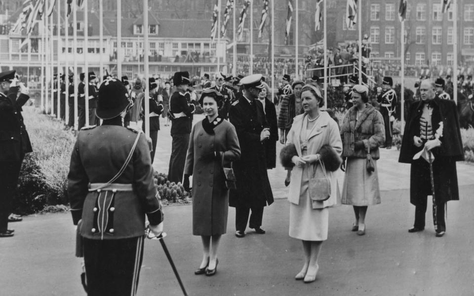 Wth Queen Juliana of the Netherlands greeting the Regimental Color of the Prins Hendrikkade in Amsterdam - Getty