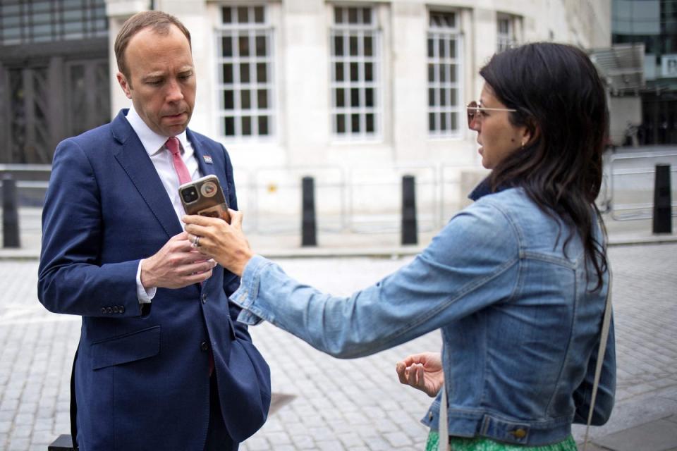 Hancock takes a look at Coladangelo’s phone when she was his aide (AFP via Getty Images)