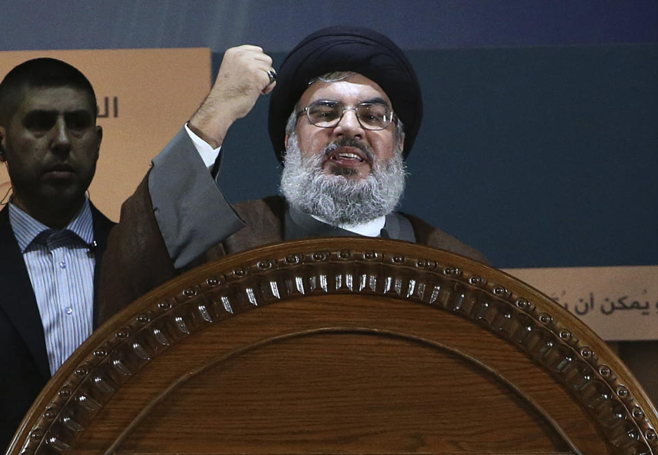 FILE - In this August 2, 2013 file photo, Hezbollah leader Sheik Hassan Nasrallah speaks during a rally to mark Jerusalem day, or Al-Quds day, in the southern suburb of Beirut, Lebanon. Nasrallah’s boast that he has 100,000 armed fighters that can be deployed against internal rivals came as a surprise to many Lebanese, not least because it was addressed to a domestic audience rather than the group’s archenemy Israel. Experts say the number — almost 20,000 more than the Lebanese army — is an exaggeration but is likely to further ratchet up anxiety of a return to sectarian fighting in the small country roiled by a series of devastating crises. (AP Photo/Hussein Malla, File)