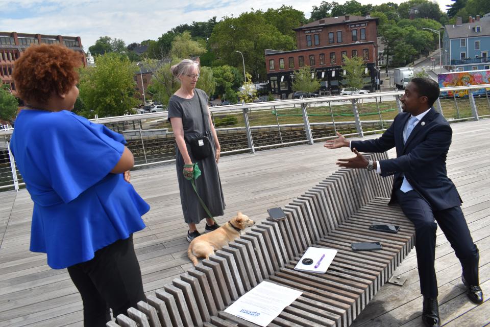 Goncalves speaks with Kathleen Gerard, a constituent who lives downtown with dog Pepita. Next to both is Goncalves' spokeswoman, Alisha Pina.