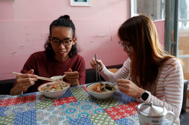 Derek Tai and his girlfriend Ann have lunch at his apartment in Hong Kong