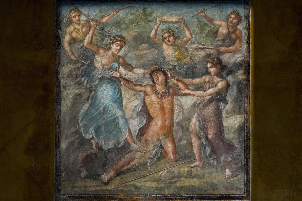 A detail of one of the frescoes that adorn a "triclinium", one of the dining rooms of the Ancient Roman Domus Vettiorum, House of Vettii, in the Pompeii Archeological Park, near Naples, southern Italy, Wednesday, Dec. 14, 2022. One of Pompeii's most famous and richest domus, which contains exceptional works of art and tells the story of the social ascent of two former slaves, is opening its doors to visitors Wednesday, Jan. 11, 2023 after 20 years of restoration. (AP Photo/Andrew Medichini)