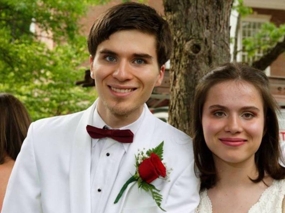 The author and her brother posing for a photo.