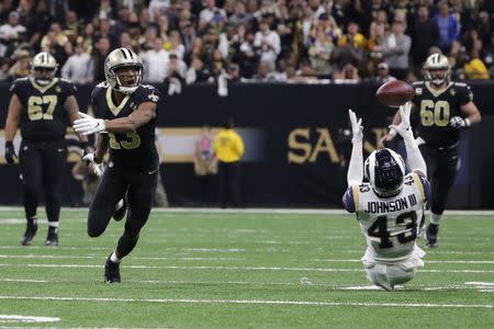 Jan 20, 2019; New Orleans, LA, USA; Los Angeles Rams strong safety John Johnson (43) intercepts a tipped pass against New Orleans Saints wide receiver Michael Thomas (13) during overtime in the NFC Championship game at Mercedes-Benz Superdome. Mandatory Credit: Derick E. Hingle-USA TODAY Sports