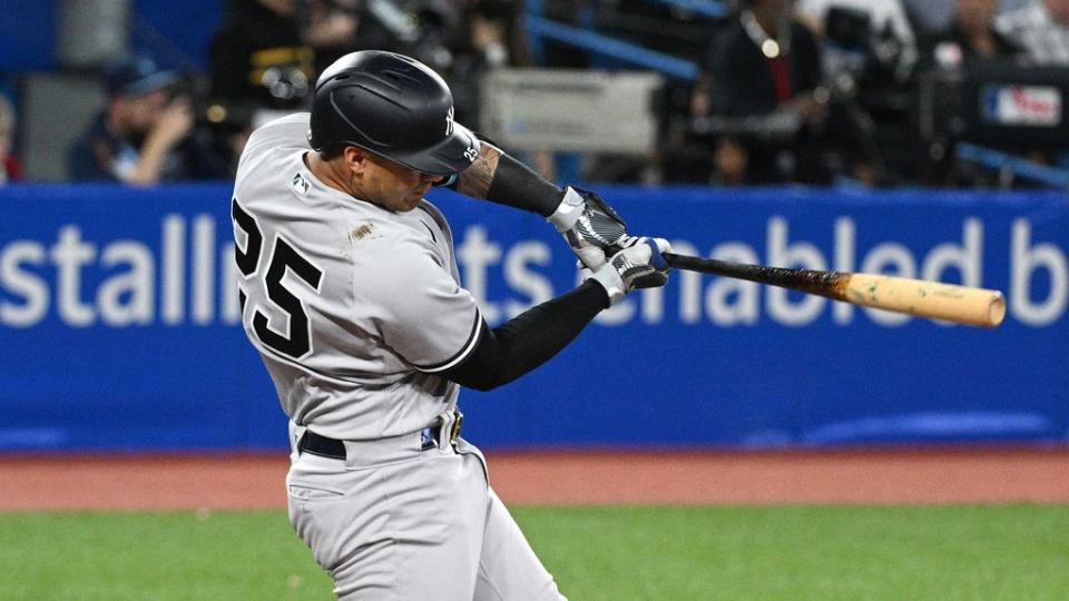 Sep 27, 2022;  Toronto, Ontario, CAN;  New York Yankees second baseman Gleyber Torres (25) hits an RBI double against the Toronto Blue Jays in the fifth inning at Rogers Centre.