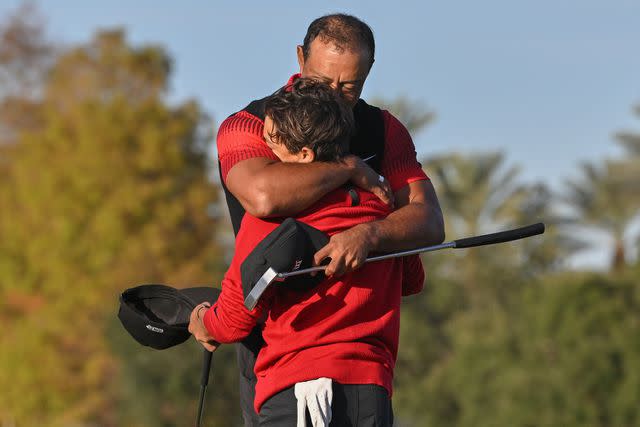 <p>Ben Jared/PGA TOUR via Getty </p> Tiger Woods hugs his son, Charlie Woods, on the 18th green during the final round of the PGA TOUR Champions PNC Championship at The Ritz-Carlton Golf Club on December 18, 2022 in Orlando, Florida.