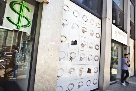 A man exits a diamonds and jewellery store at the Diamonds Exchange district in Ramat Gan near Tel Aviv, Israel June 23, 2015. REUTERS/Nir Elias