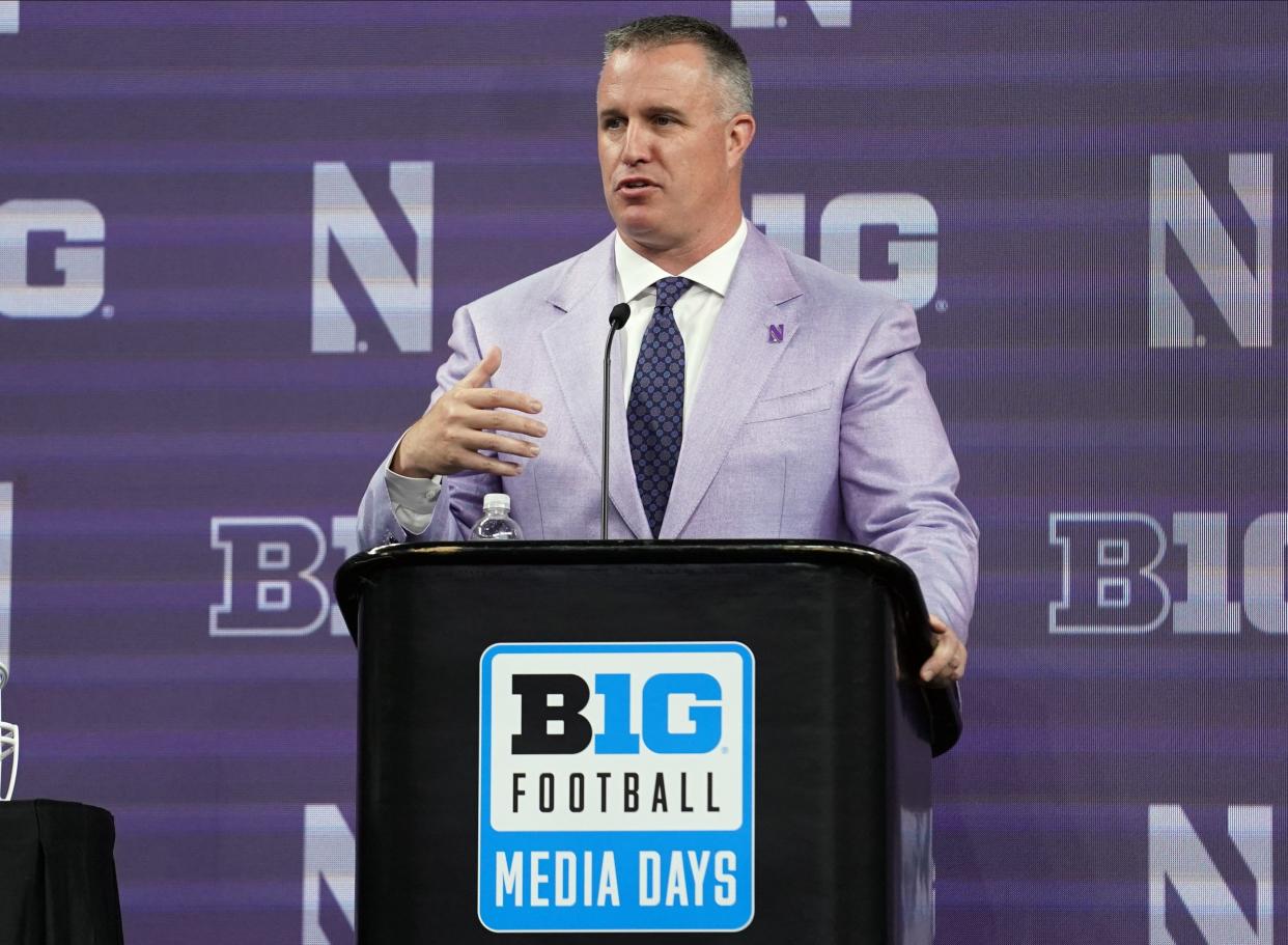 Northwestern coach Pat Fitzgerald talks to the media during Big 10 football media days at Lucas Oil Stadium in Indianapolis.