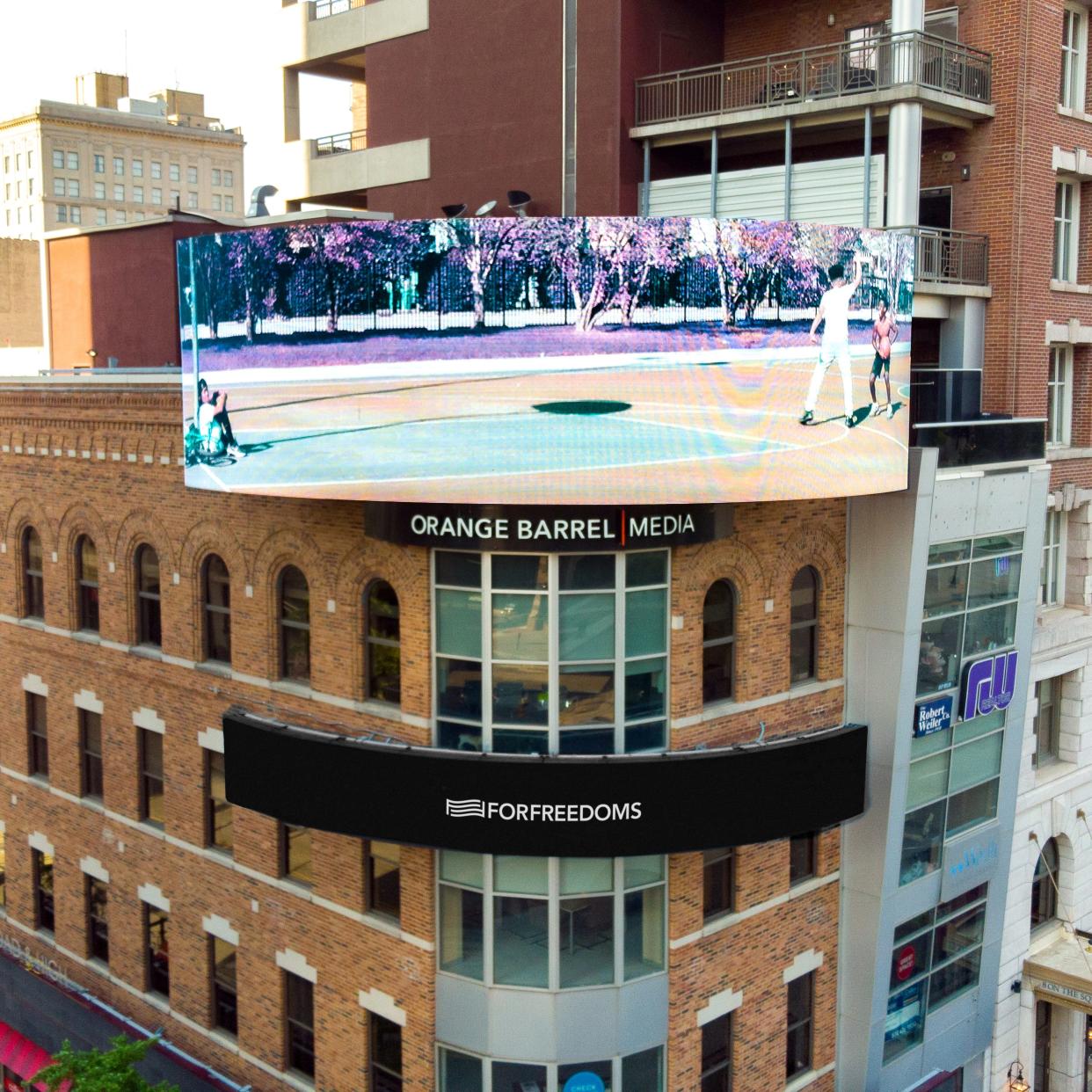 The photo titled “You Talk Over a Beat,” taken by artist Anwulika Anigbo, is shown over the Tim Horton's on the corner of Broad and High streets.