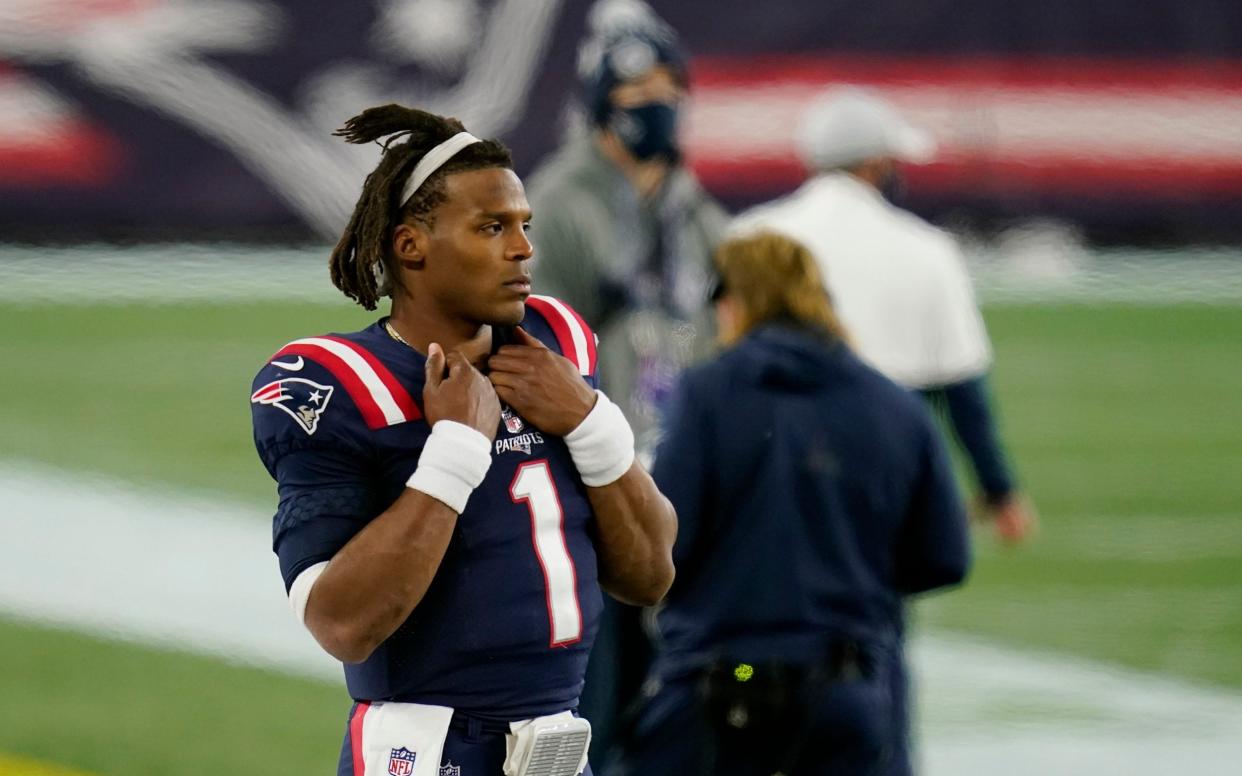 New England Patriots quarterback Cam Newton watches from the sideline after being replaced by Jarrett Stidham in the second half of an NFL football game against the San Francisco 49ers, Sunday, Oct. 25, 2020, in Foxborough, Mass.  - AP