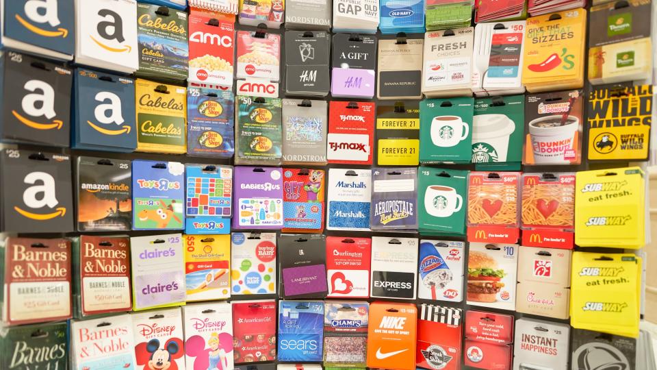 A display showing gift cards for various retailers