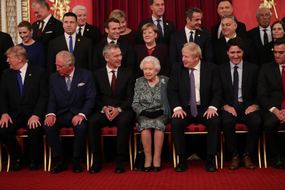 Queen Elizabeth II and Prime Minister Boris Johnson joins other Nato leaders for a group photograph Chancellor of Germany, Angela Merkel, talks to Queen Elizabeth II during a reception at Buckingham Palace, London, as they gathered to mark 70 years of the alliance.