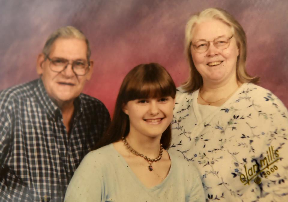 Amber Brockway pictured with her parents in a photo provided by her mother, Joanne Brockway. The Watkins Glen teen was brutally murdered in August 2000 by a classmate. 