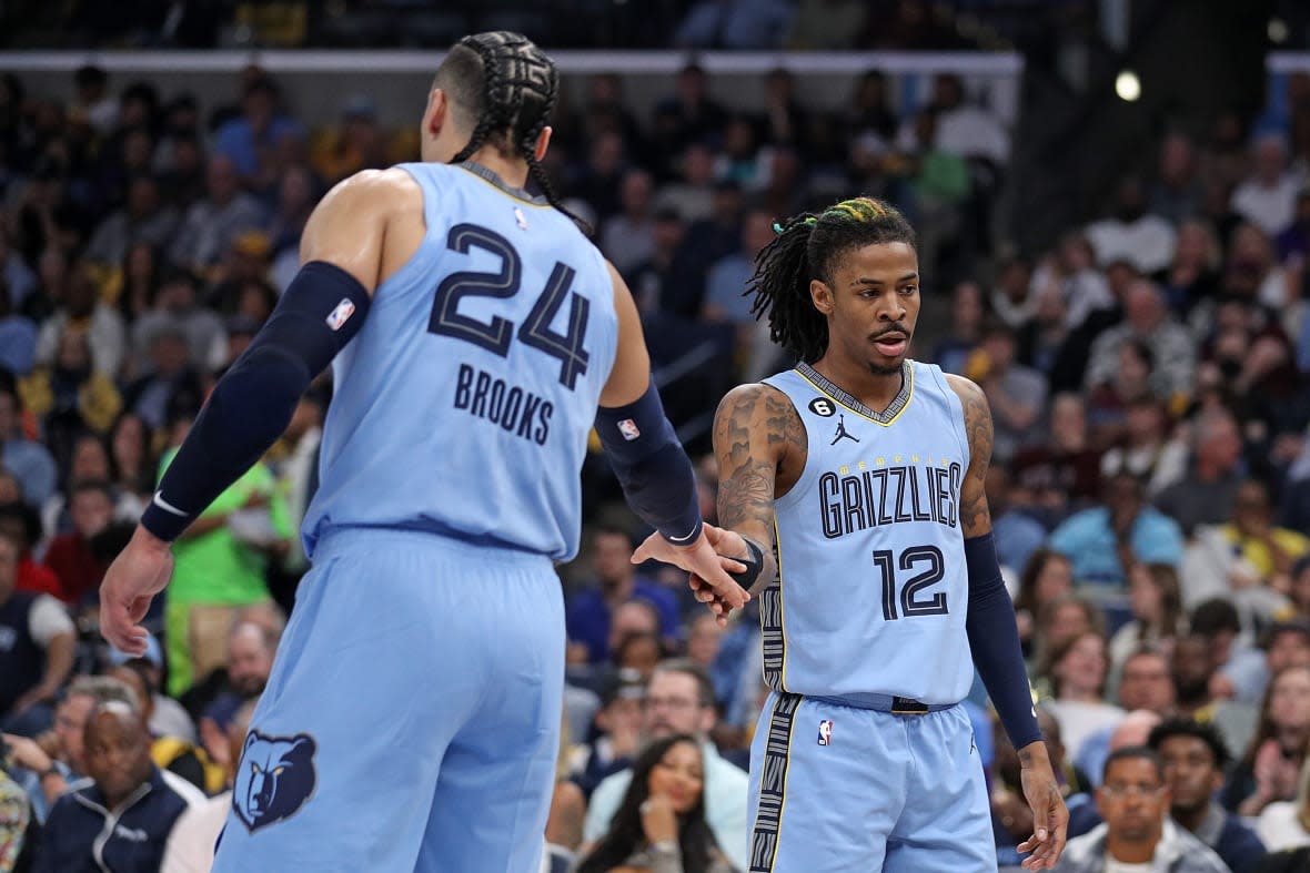 Dillon Brooks #24 of the Memphis Grizzlies and Ja Morant #12 of the Memphis Grizzlies during the first half against the Los Angeles Lakers of Game Five of the Western Conference First Round Playoffs at FedExForum on April 26, 2023 in Memphis, Tennessee. (Photo by Justin Ford/Getty Images)