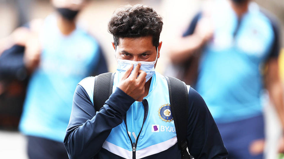 Kuldeep Yadav of India arrives in a face mask during the India nets session at the SCG.