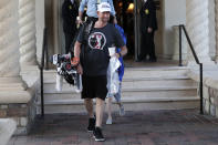 Webb Simpson leaves the clubhouse after the PGA tour canceled the rest of The Players Championship golf tournament as a result of the coronavirus pandemic, Friday, March 13, 2020, in Ponte Vedra Beach, Fla. (AP Photo/Lynne Sladky)