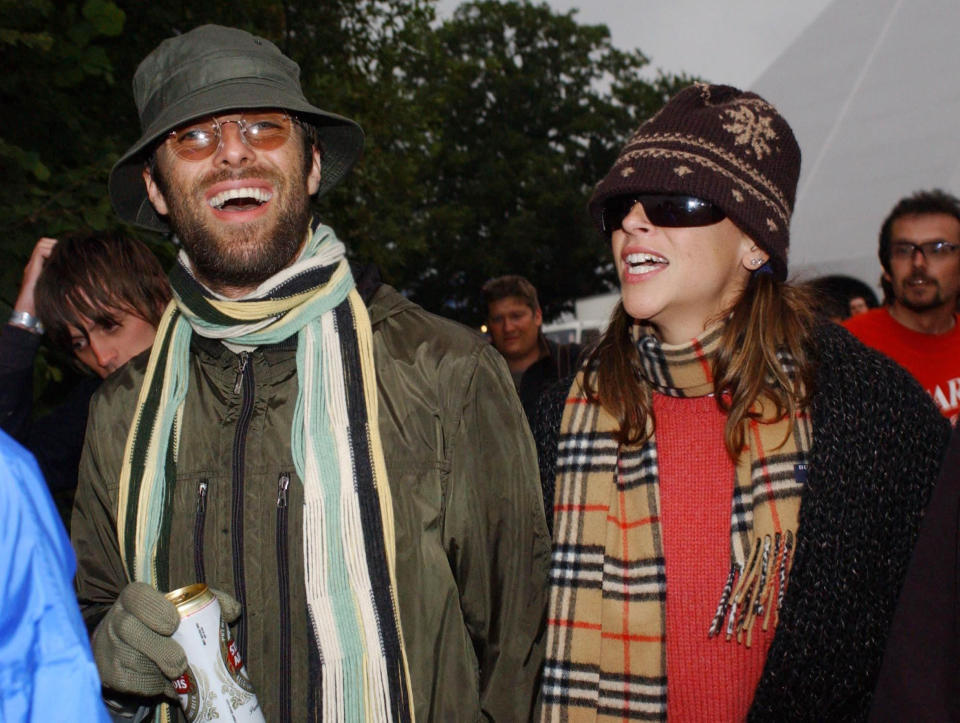 Liam Gallagher, left, and Nicole Appleton, right, back stage during the Glastonbury Festival, held at Worthy Farm in Pilton, Somerset , England, Saturday June 26, 2004. (AP Photo/Yui Mok/PA)  ** UNITED KINGDOM OUT MAGS OUT NO SALES  **