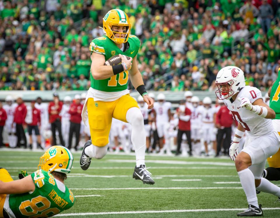 Oregon quarterback Bo Nix leaps into the end zone for a touchdown as the No. 9 Oregon Ducks host Washington State Saturday, Oct. 21, 2023, at Autzen Stadium in Eugene, Ore.