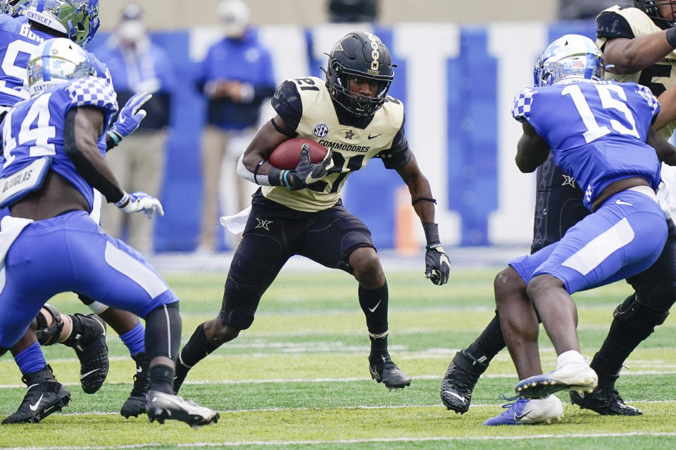 Vanderbilt linebacker Kenny Hebert (21) runs with the ball during the first half of an NCAA college football game against Kentucky, Saturday, Nov. 14, 2020, in Lexington, Ky. (AP Photo/Bryan Woolston)