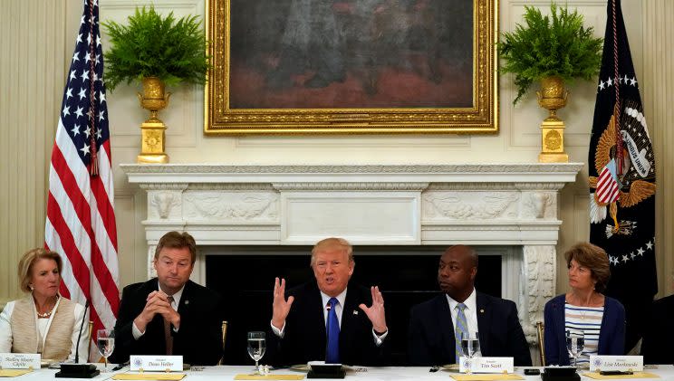Republican Sens. Shelley Moore Capito, Dean Heller, Tim Scott and Lisa Murkowski join President Trump at a lunch meeting to discuss health care. (Photo: Kevin Lamarque/Reuters)