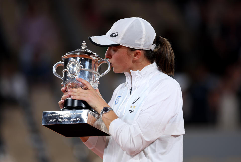 Iga Swiatek, pictured here kissing the trophy after winning her second French Open title.